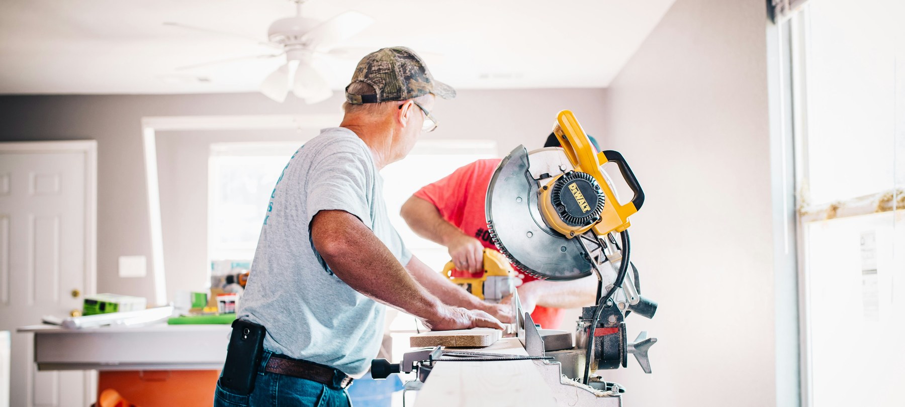 Joiners cutting timber on a mitre saw