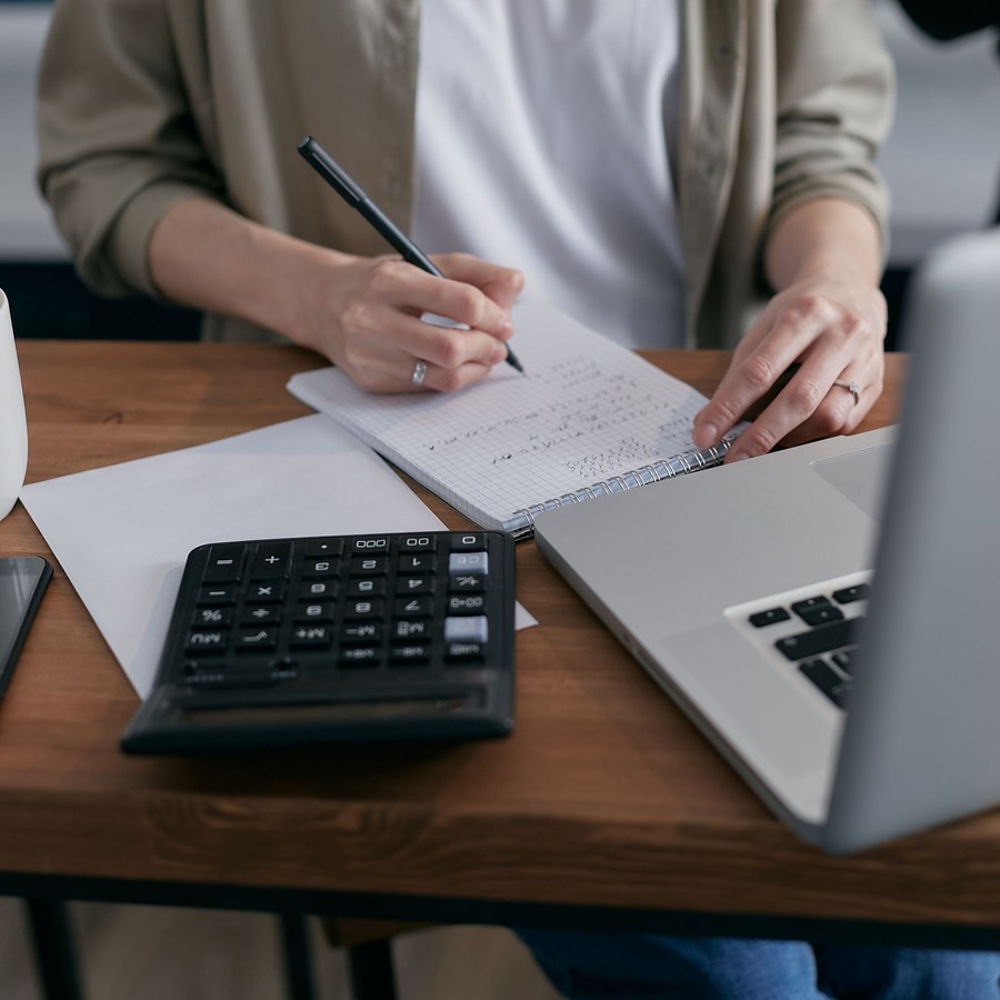 Working through payroll figures at a desk