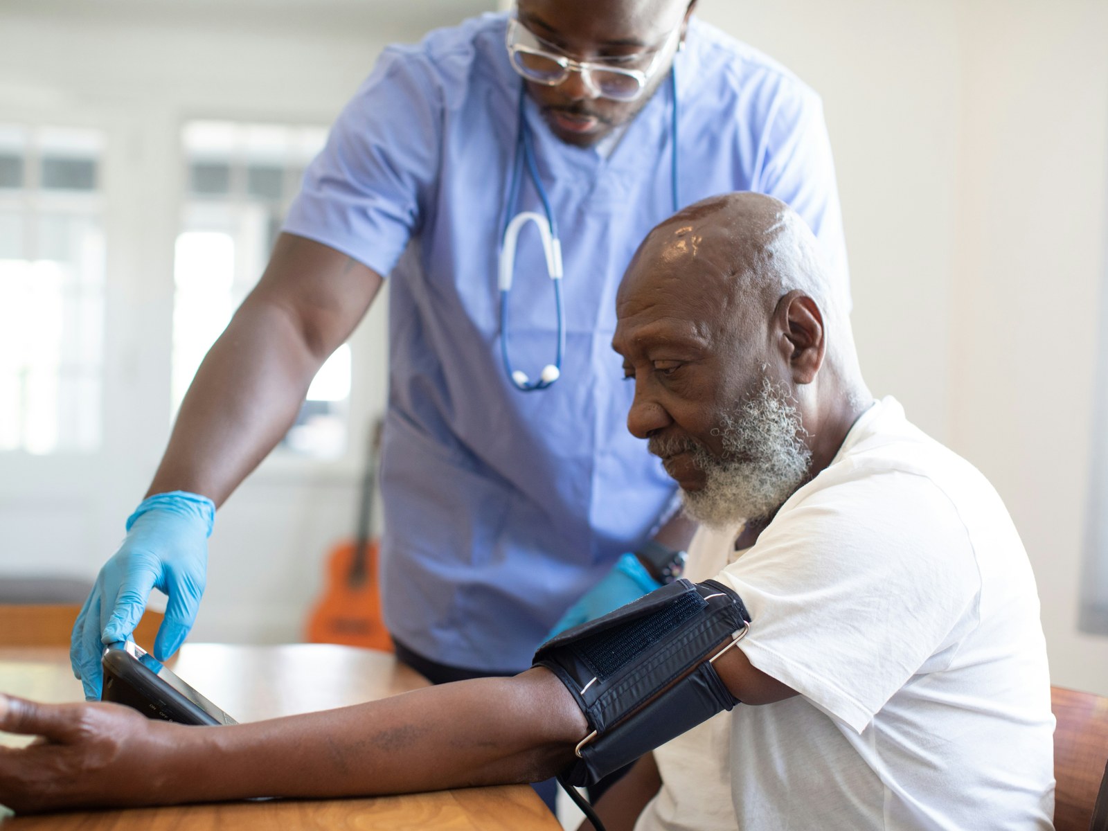 Nurse checking a patient's blood pressure