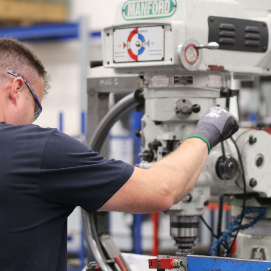 Machinist working at a milling machine