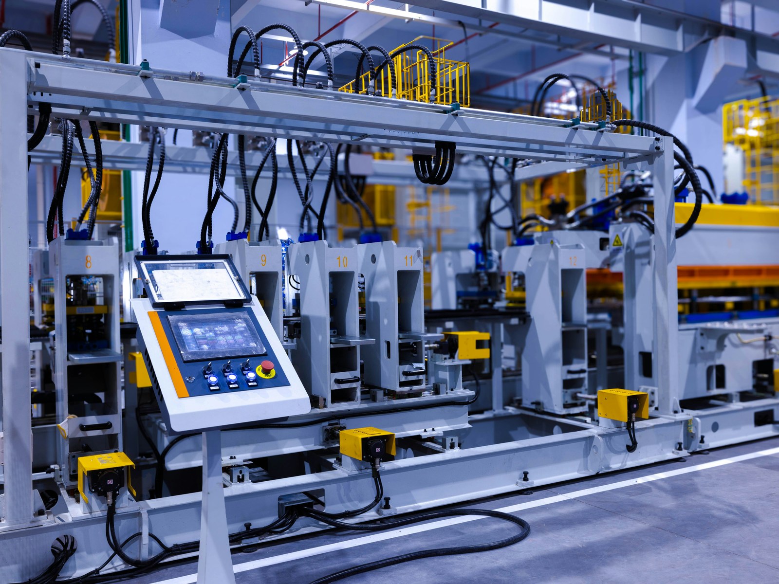 Automated press line on a factory floor